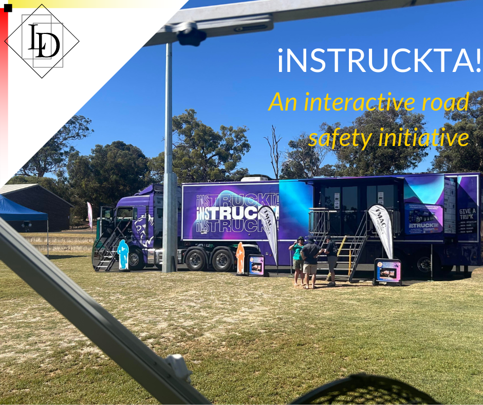 Truck parked in a paddock with people milling around outside