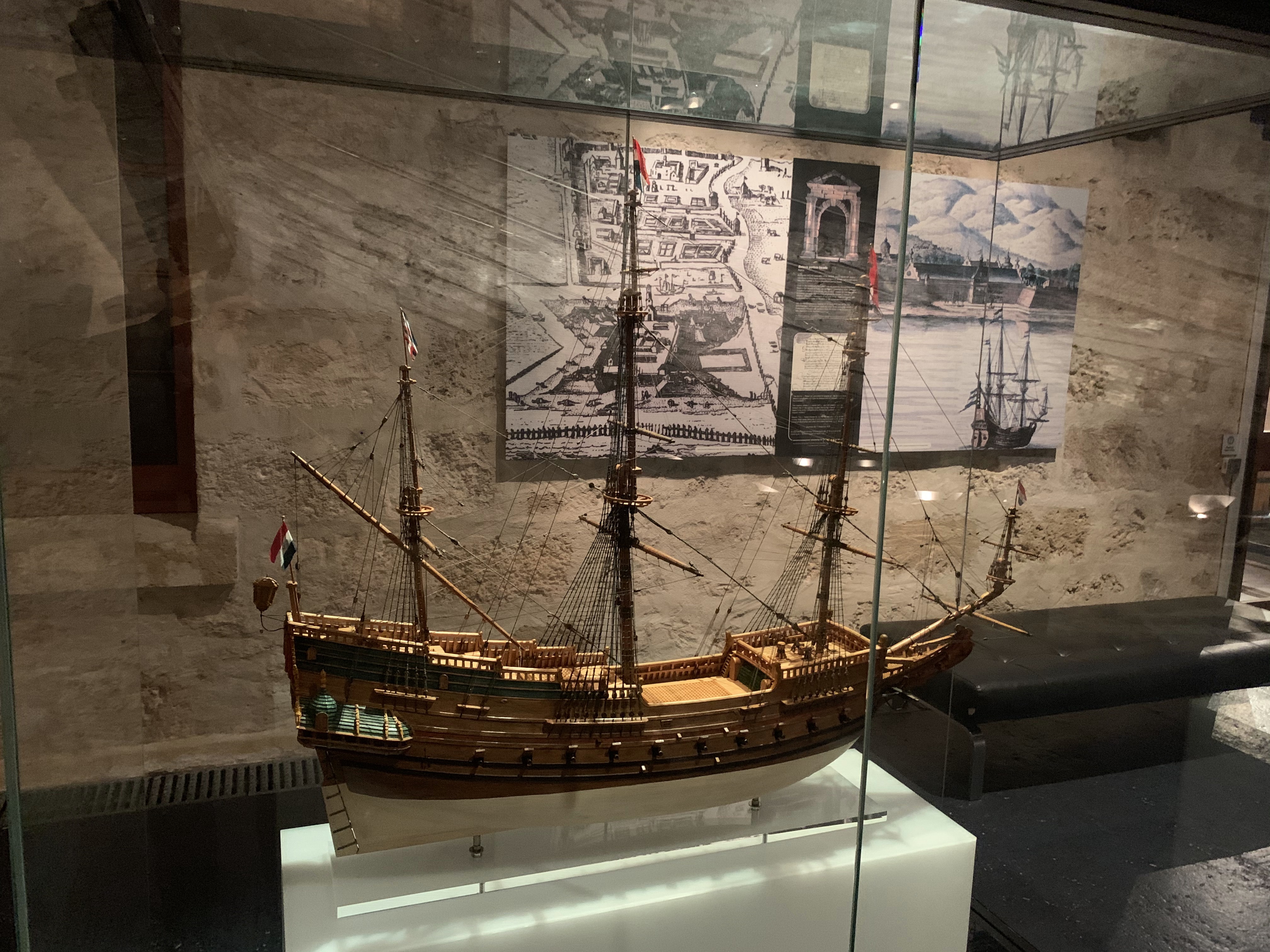 It is a picture of a model of a sailing ship on display at the Western Australia Shipwrecks museum. The model bears the flags of the VOC. 